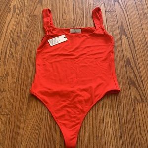 Babaton one piece string thong fluorescent Orange/pink new with tags size small